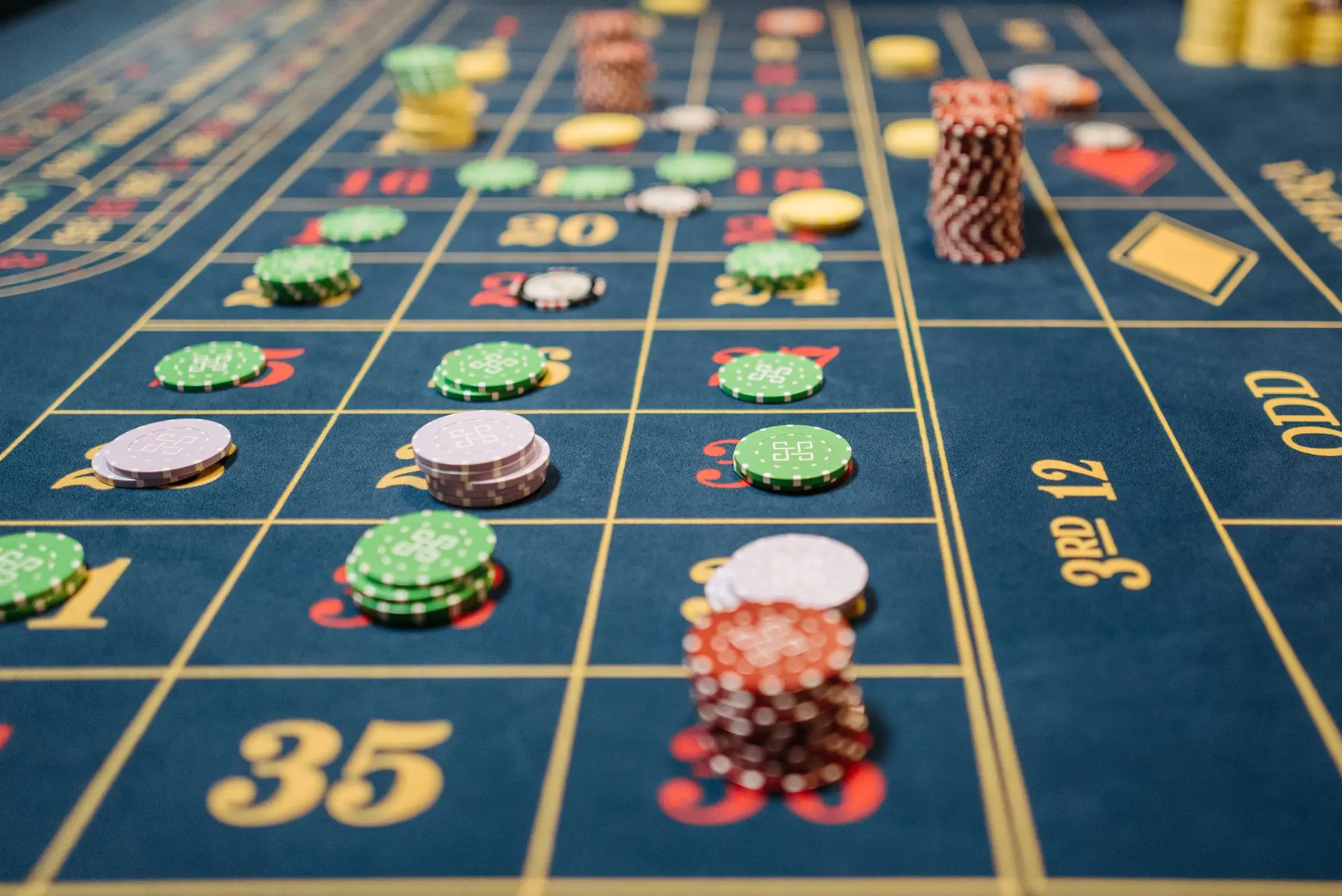 Close-up of roulette table with colorful chips