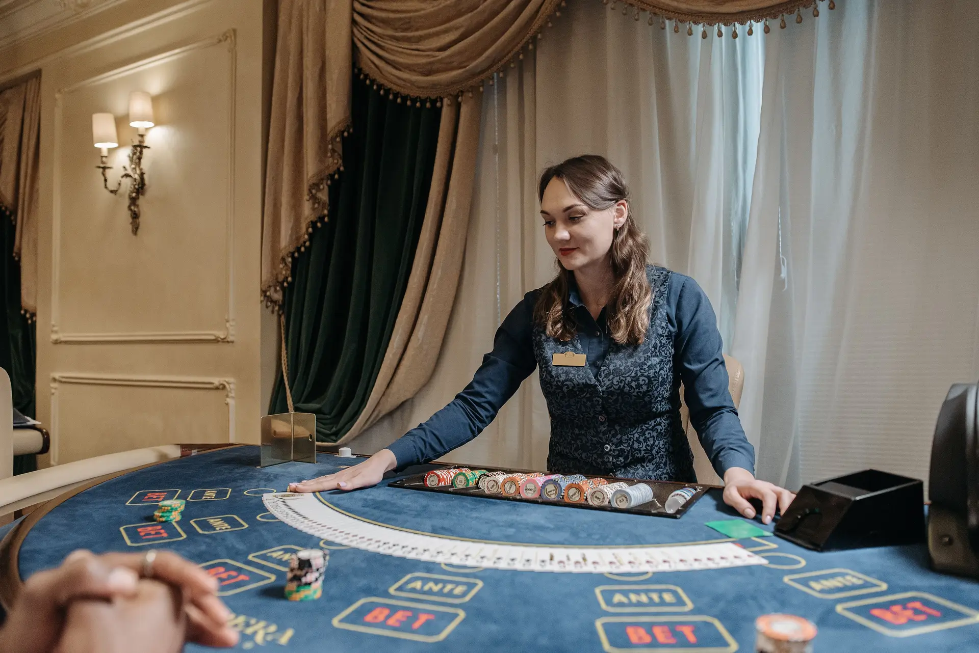 Professional dealer managing cards in an elegant atmosphere